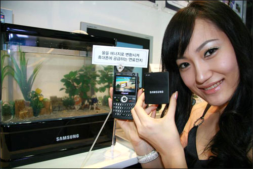 When the phone powers on, metal and water in the phone react and  produce hydrogen gas which powers the cellphone.