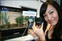 When the phone powers on, metal and water in the phone react and  produce hydrogen gas which powers the cellphone.