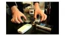 Four cellphones called at the same time, facing popcorn kernels
