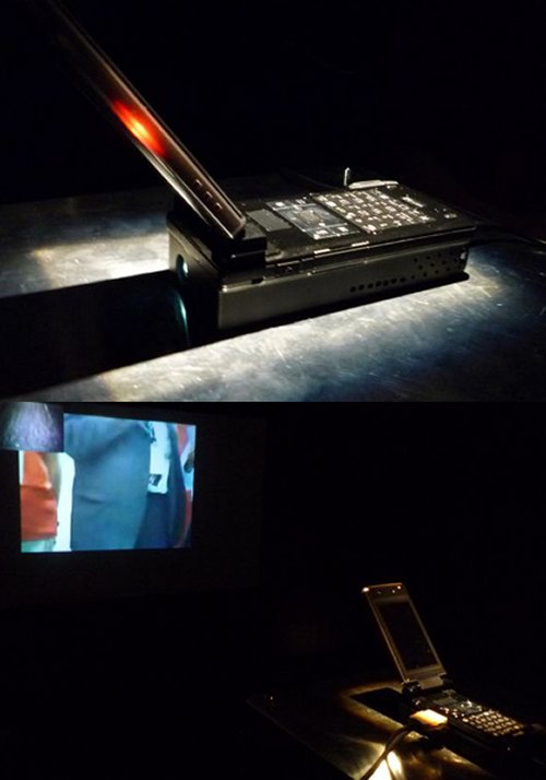 Docomo shows off pocket cinema cell phone projector