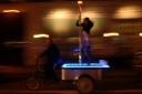 Bicycle Rickshaw with stripper pole leaves a trail of dollar bills