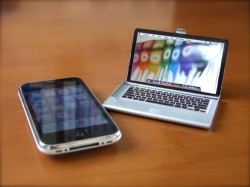 A MacBook that holds Business Cards