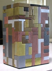 125-piece metal puzzle can be put together to make a working gun